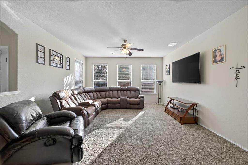 9332 San Tejas Drive Fort Worth, TX 76177 - Photo 11 of 38 a living room with furniture and a flat screen tv