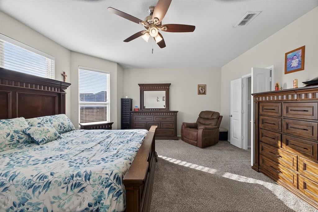 9332 San Tejas Drive Fort Worth, TX 76177 - Photo 14 of 38 a bedroom with a bed dresser and a window