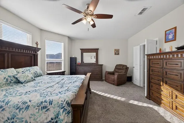 a spacious bathroom with a bathtub sink and mirror