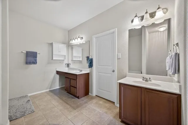 a white bath tub sitting next to a white toilet