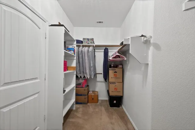 a room with a sink and cabinets