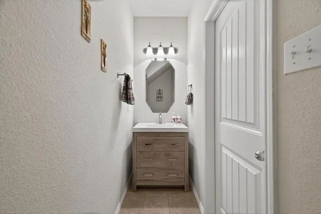 a spacious bedroom with a bed and a couch