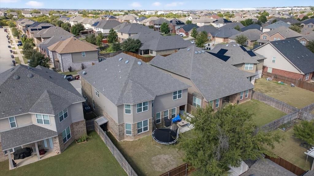 9332 San Tejas Drive Fort Worth, TX 76177 - Photo 35 of 38 an aerial view of multiple houses with a yard