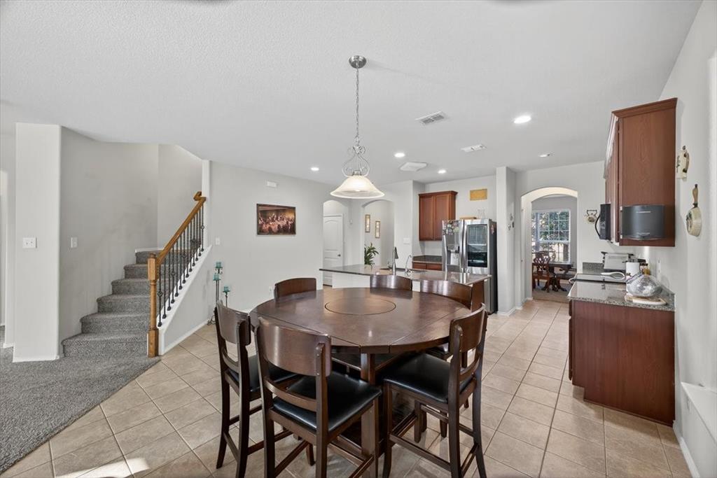 9332 San Tejas Drive Fort Worth, TX 76177 - Photo 9 of 38 a dining room with furniture and entryway