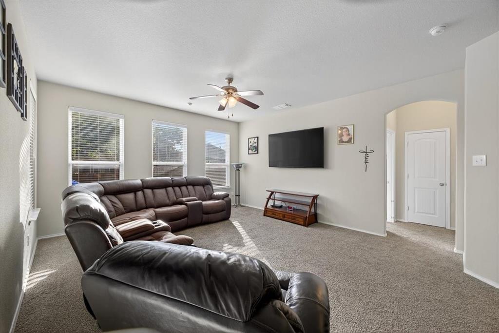 9332 San Tejas Drive Fort Worth, TX 76177 - Photo 10 of 38 a living room with furniture and a flat screen tv