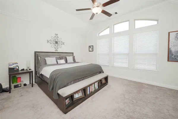 a bedroom with a bed and window