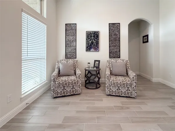 a living room with furniture and a window