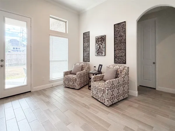 a living room with furniture and a window