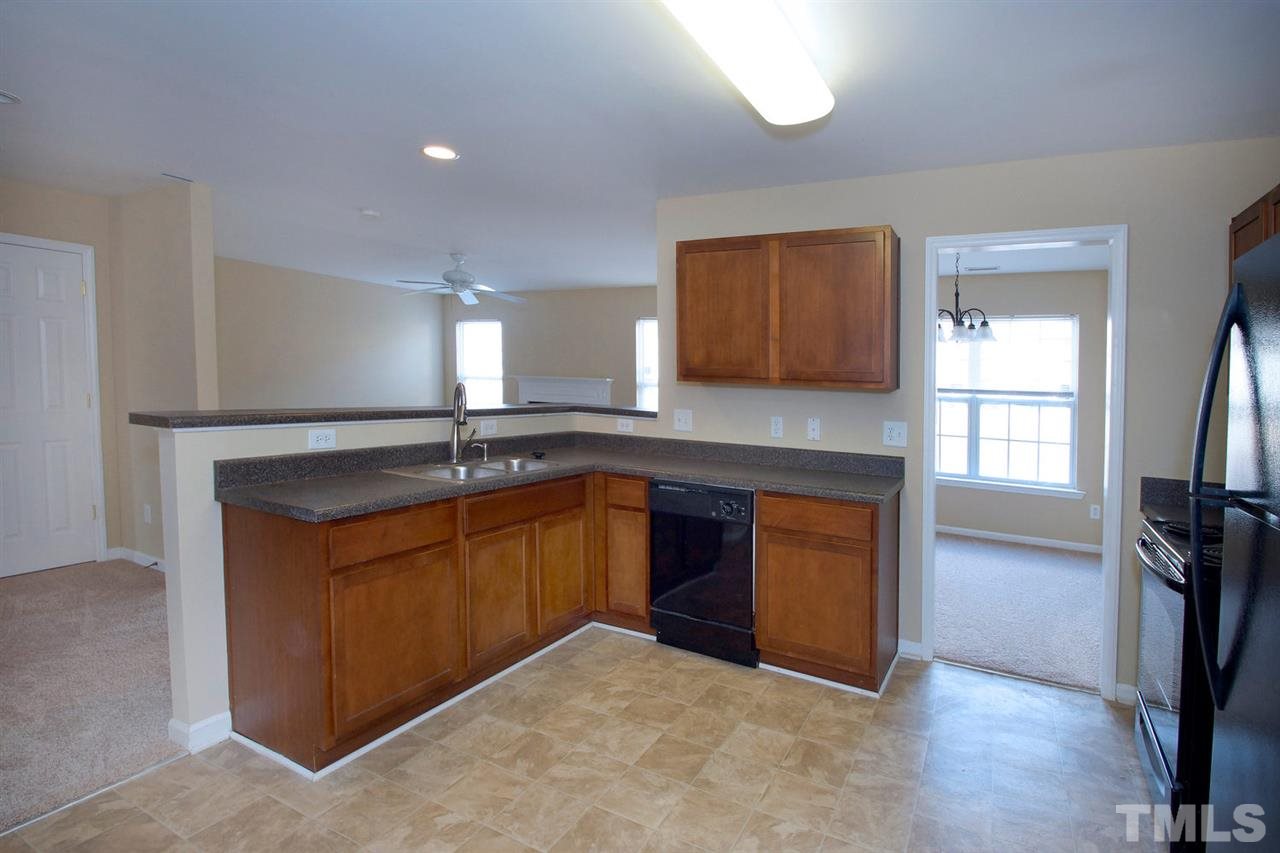 1505 Pebble Ridge Drive Raleigh, NC 27610 - Photo 7 of 23 Note roomy kitchen with pantry. Fridge and stove 2 years old. New microwave. Vinyl 2 years old.