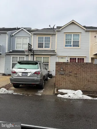 a car parked in front of a house
