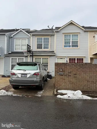 a car parked in front of a house