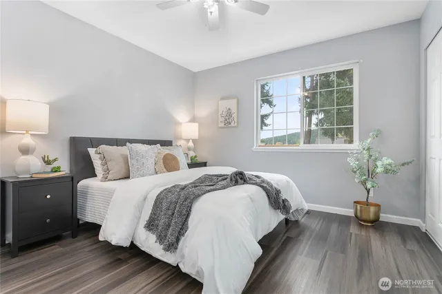 a bedroom with bed and a window