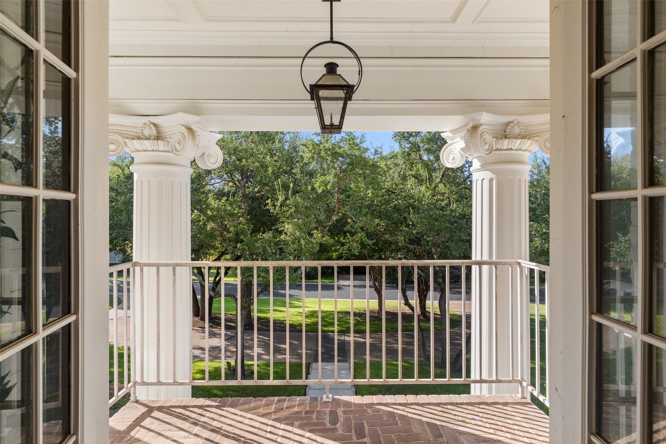 4201 Green Cliffs Road Austin, TX 78746 - Photo 24 of 40 Perched among the tree canopy, this covered balcony provides a serene spot to enjoy morning coffee while listening to local birds in Green Park