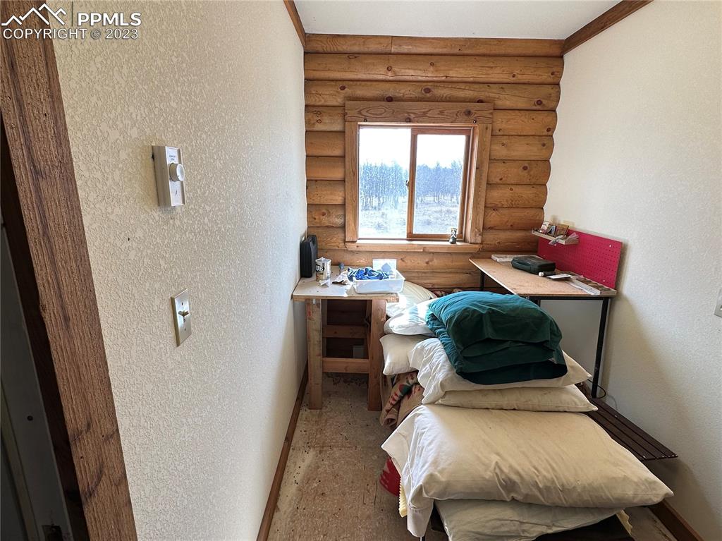 1327 County Road 863 Victor, CO 80860 - Photo 16 of 29 a bedroom with a bed and a window