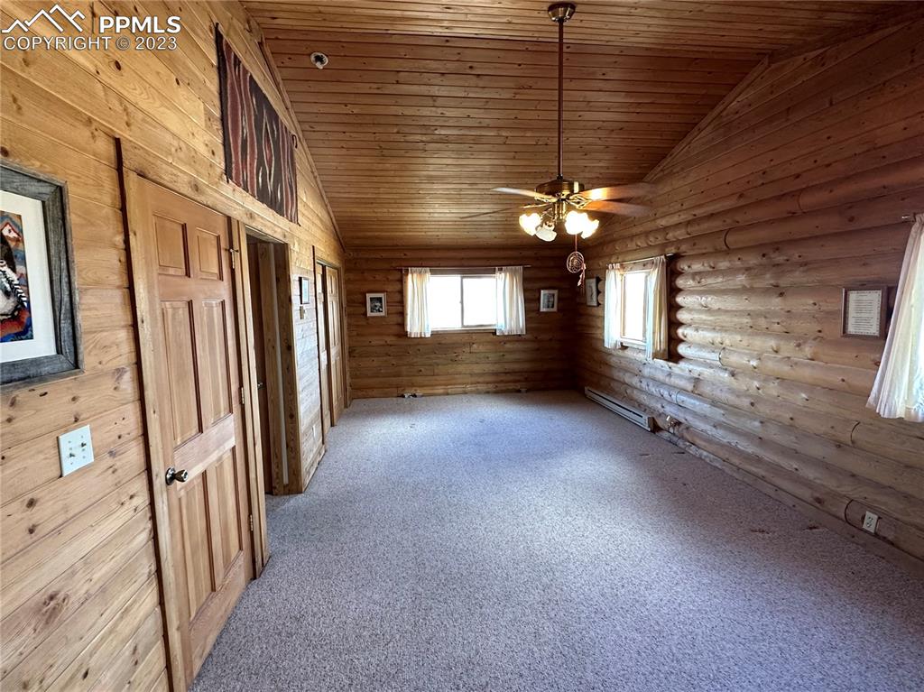 1327 County Road 863 Victor, CO 80860 - Photo 6 of 29 a view of a hallway with a window and chandelier