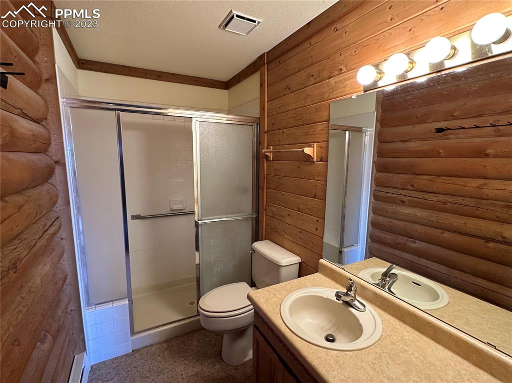 1327 County Road 863 Victor, CO 80860 - Photo 7 of 29 a bathroom with a sink toilet and shower