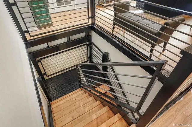 a view of outdoor space with wooden floor and stairs