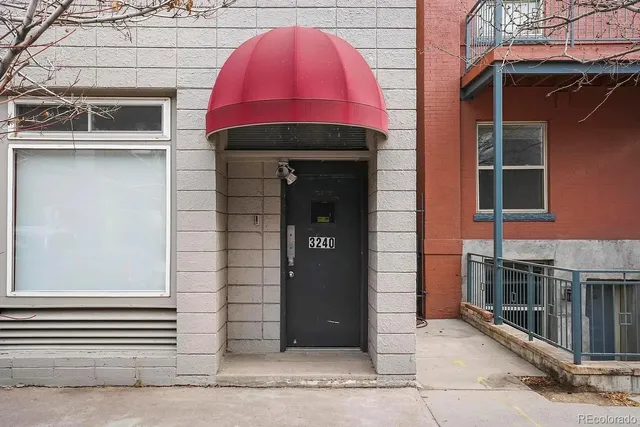 a front view of a building with a garage