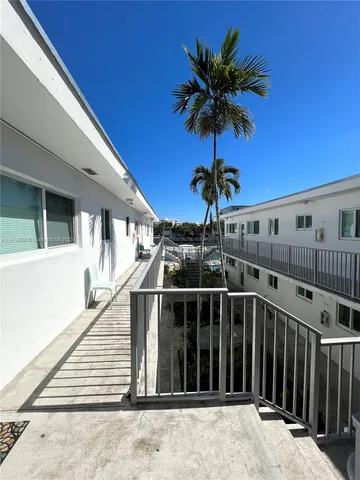 a kitchen with stainless steel appliances a refrigerator sink and cabinets