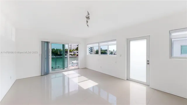 a view of a living room with furniture and window