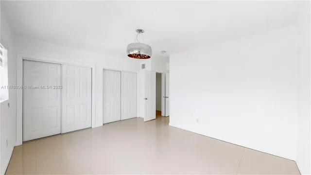 a bathroom with a sink a toilet a shower and a mirror