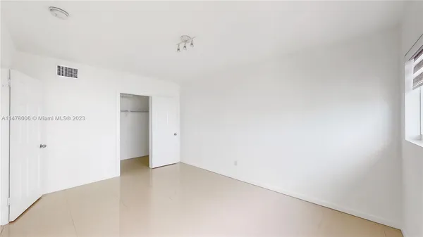 a view of staircase with lots of green walls and wooden floor
