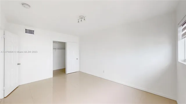 a view of staircase with lots of green walls and wooden floor