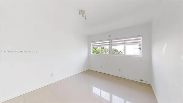 a kitchen with a sink cabinets and stainless steel appliances