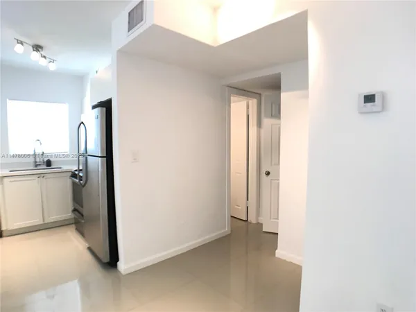 a kitchen with a sink and a stove top oven