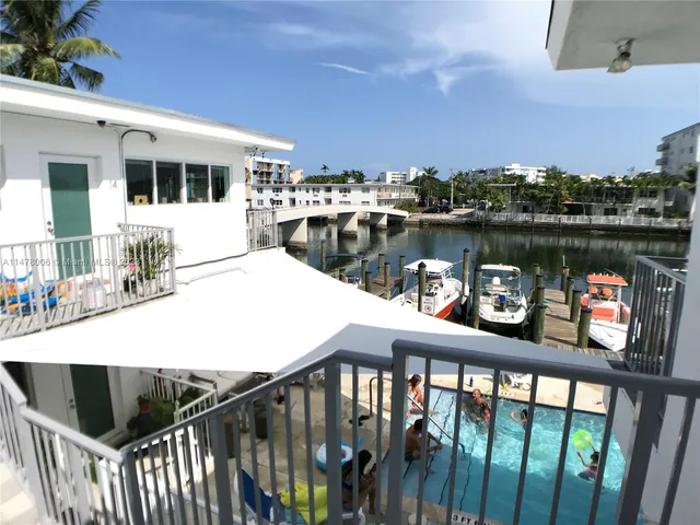 a view of a house with a palm tree