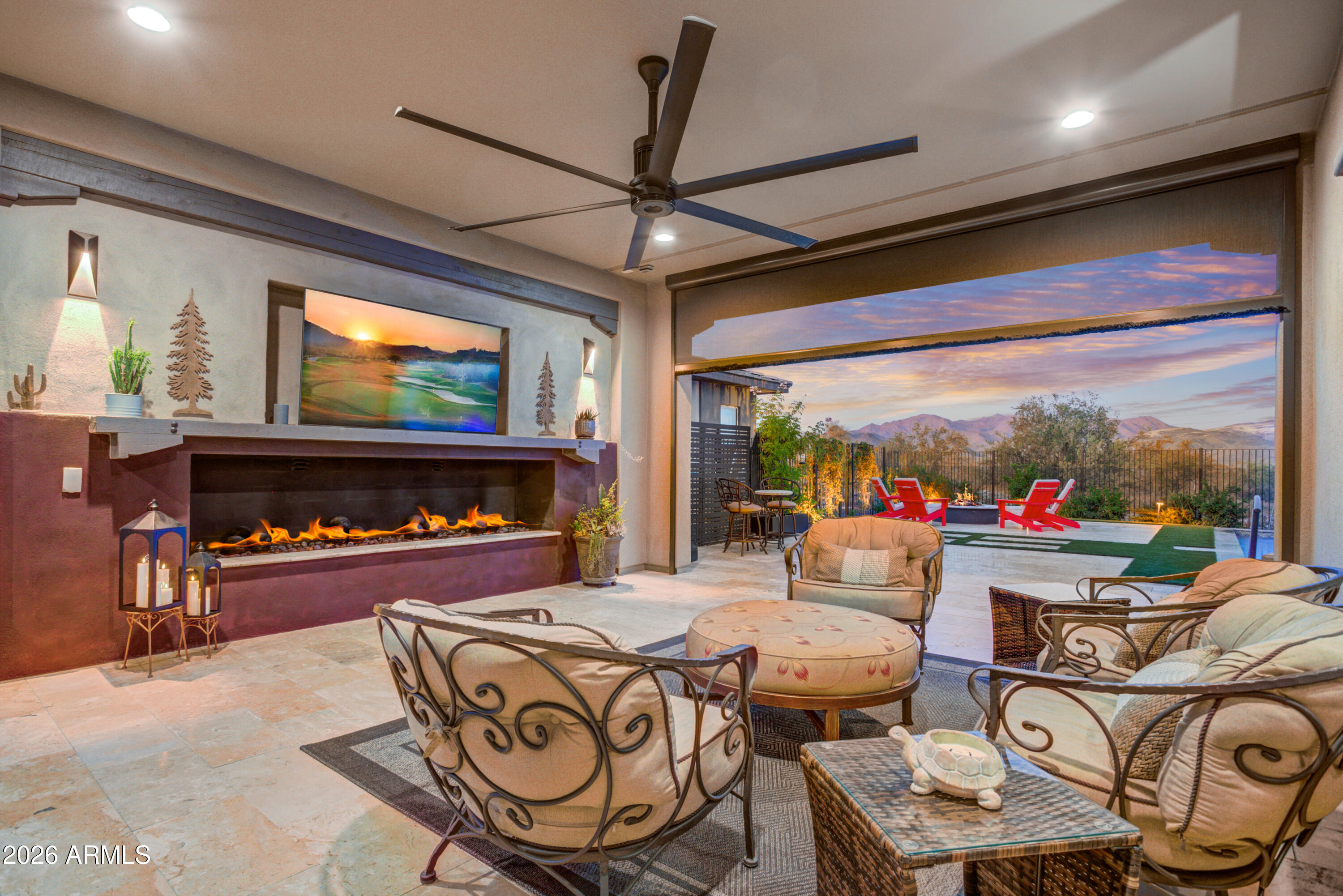28517 North Camel Rock Court Rio Verde, AZ 85263 - Photo 25 of 39 a living room with furniture a floor to ceiling window and a flat screen tv