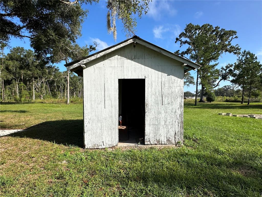 5542 Southwest 57th Avenue Gainesville, FL 32608 - Photo 13 of 15 a view of a house with a yard