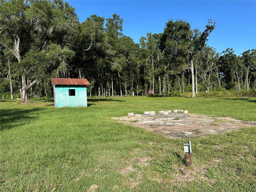 5542 Southwest 57th Avenue Gainesville, FL 32608 - Photo 10 of 15 a house view with a play ground in front of it