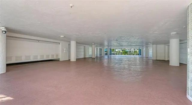 a view of a room with walk in closet and wooden floor
