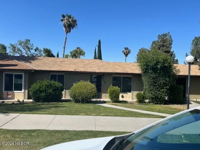 304 Calvin Street Taft, CA 93268 - Photo 1 of 1 a front view of a house with garden