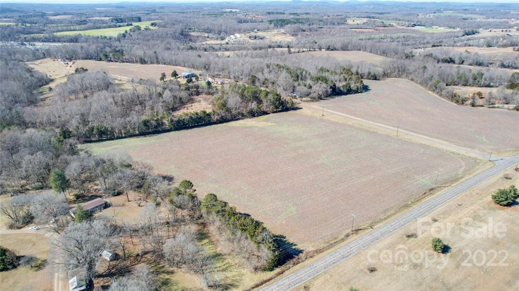 26 Mitchell Farm Road Statesville, NC 28625 - Photo 23 of 23 a view of a dry yard with a barn