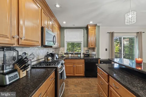 a kitchen with lots of counter top space and a sink