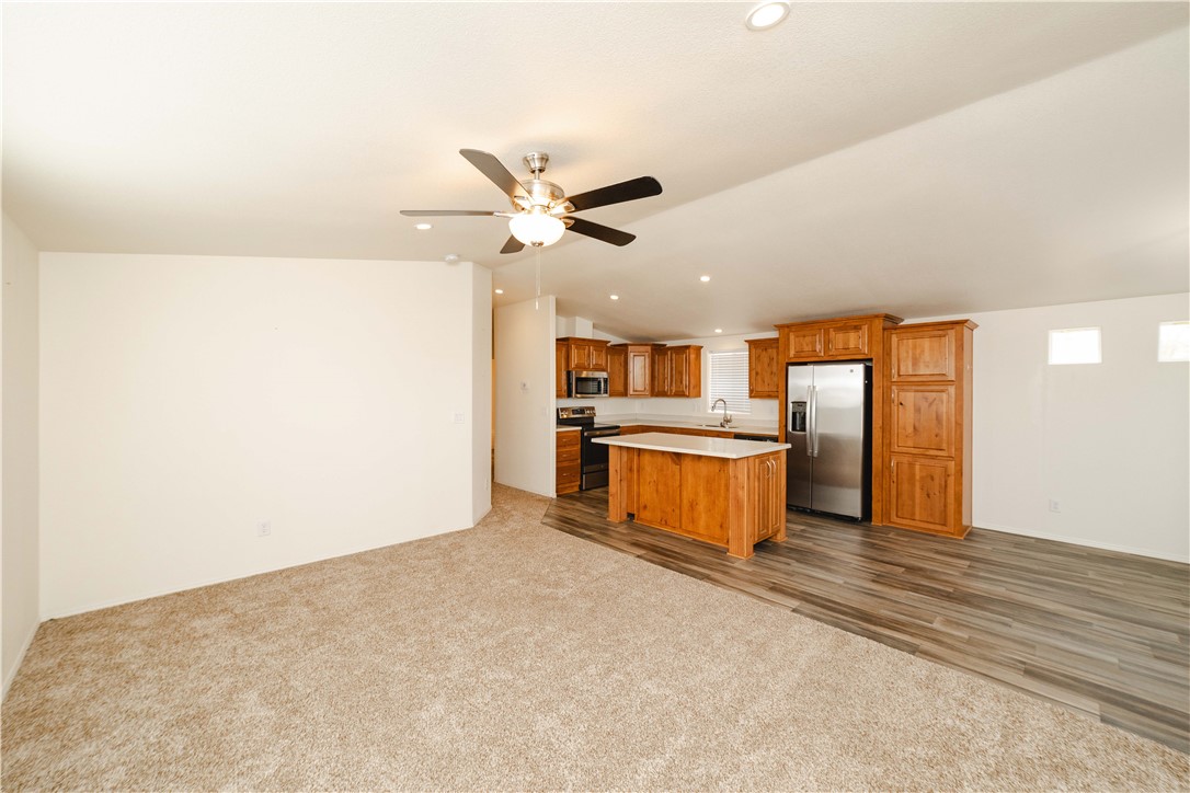 2001 Gold Road Kingman, AZ 86401 - Photo 11 of 57 a large kitchen with stainless steel appliances a refrigerator and a stove top oven
