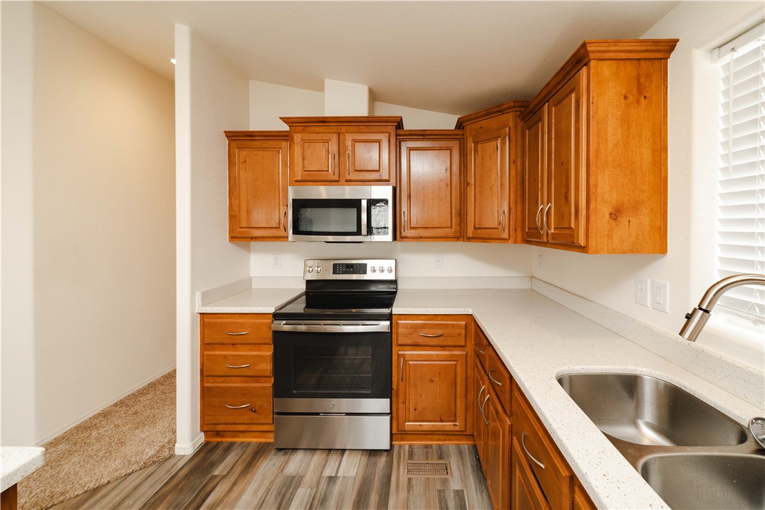 2001 Gold Road Kingman, AZ 86401 - Photo 13 of 57 a kitchen with a sink stove and microwave
