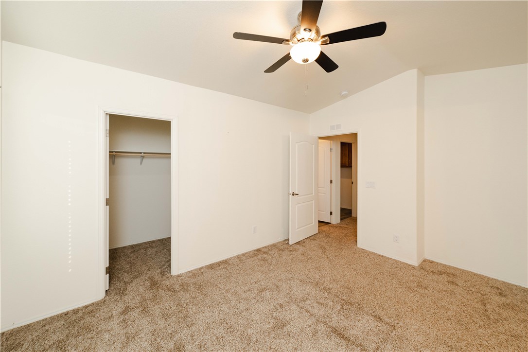 2001 Gold Road Kingman, AZ 86401 - Photo 22 of 57 a view of an empty room and a ceiling fan