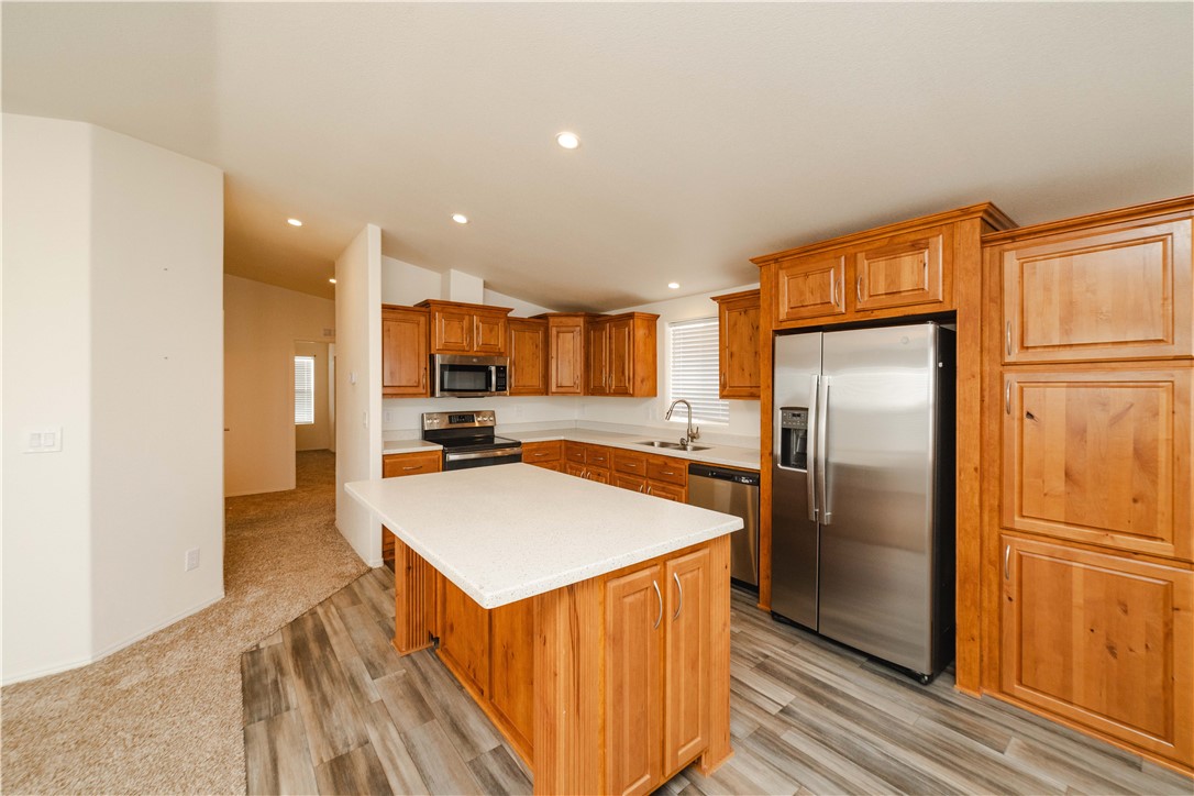 2001 Gold Road Kingman, AZ 86401 - Photo 10 of 57 a kitchen with stainless steel appliances granite countertop a refrigerator a sink and a stove