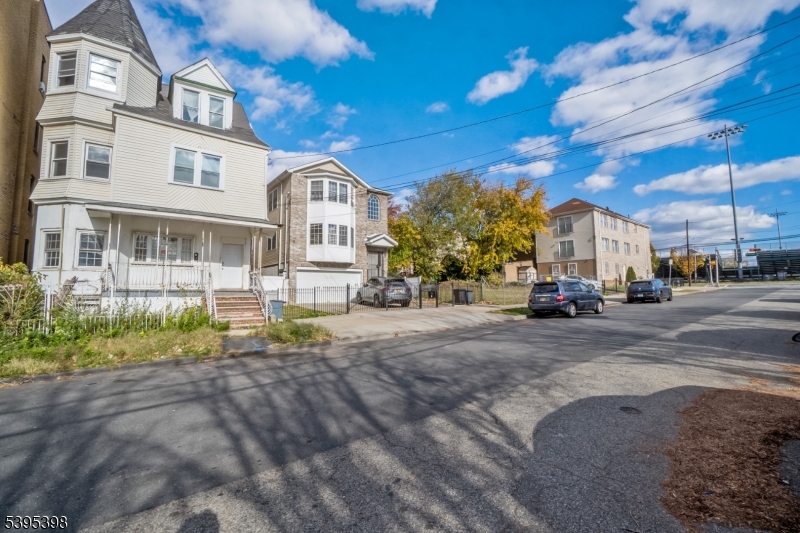 a view of street with parked cars