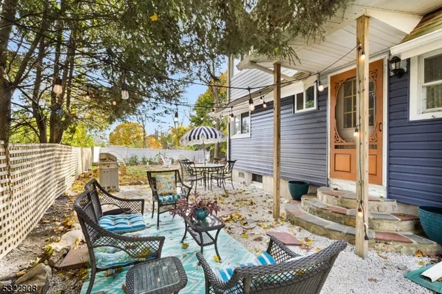 a view of a chairs and table in the patio