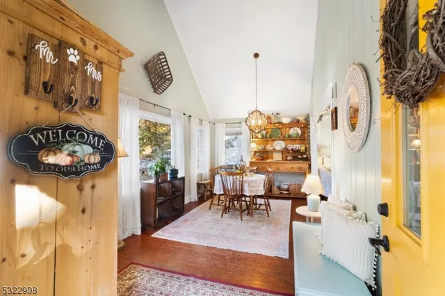 a view of living room with furniture and floor to ceiling window