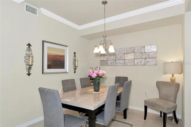 a view of a patio with lake view and a floor to ceiling window