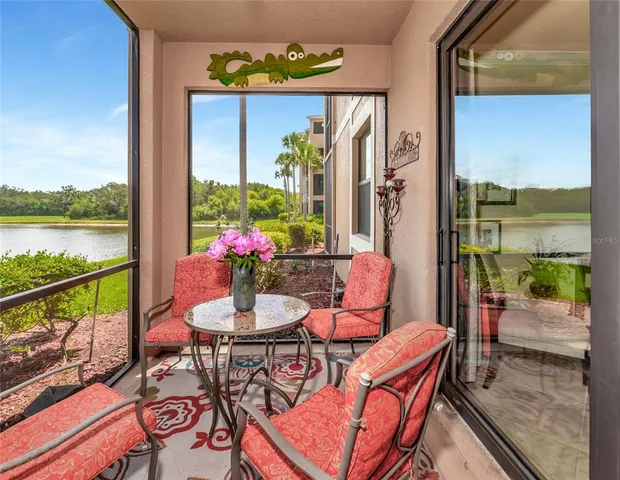 a view of a swimming pool with a lawn chairs