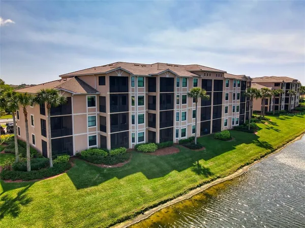 a view of a big yard with large windows and a big yard