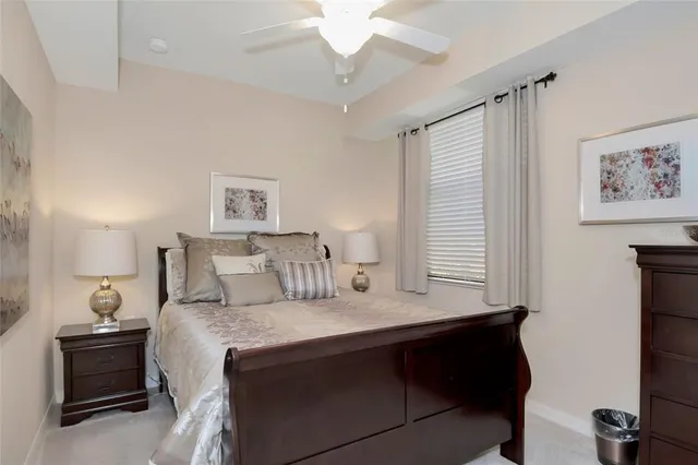 a dining room with furniture a rug and a large window