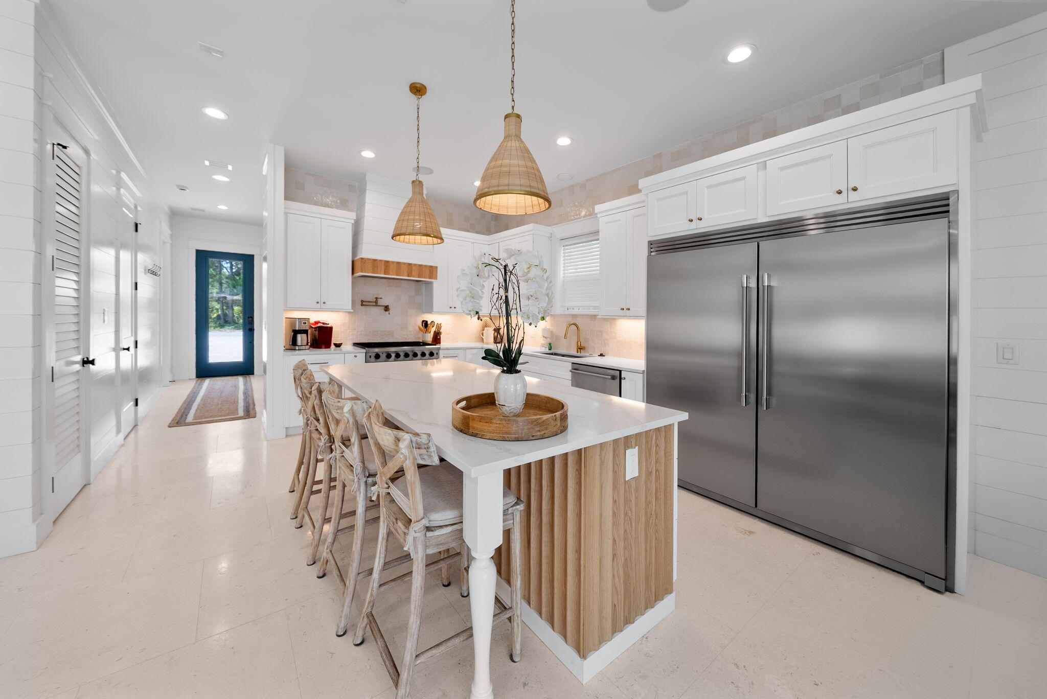 89 Sand Dollar Court Santa Rosa Beach, FL 32459 - Photo 13 of 89 a kitchen with stainless steel appliances granite countertop a kitchen island a stove a refrigerator a oven a dining table and chairs