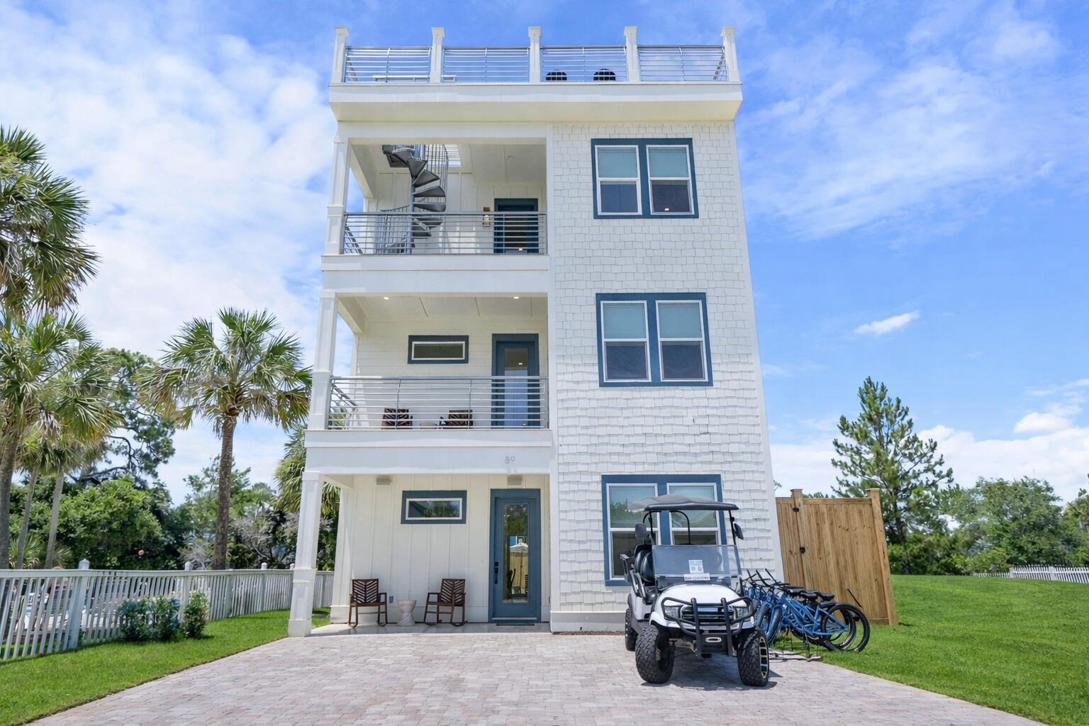 89 Sand Dollar Court Santa Rosa Beach, FL 32459 - Photo 88 of 89 a front view of a house with garden